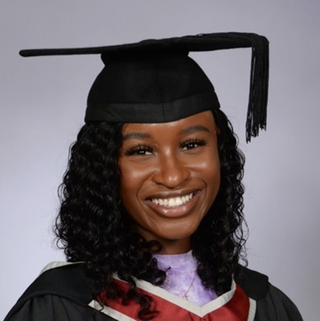 Portrait of Luci-Anne Anson in a graduation cap and gown